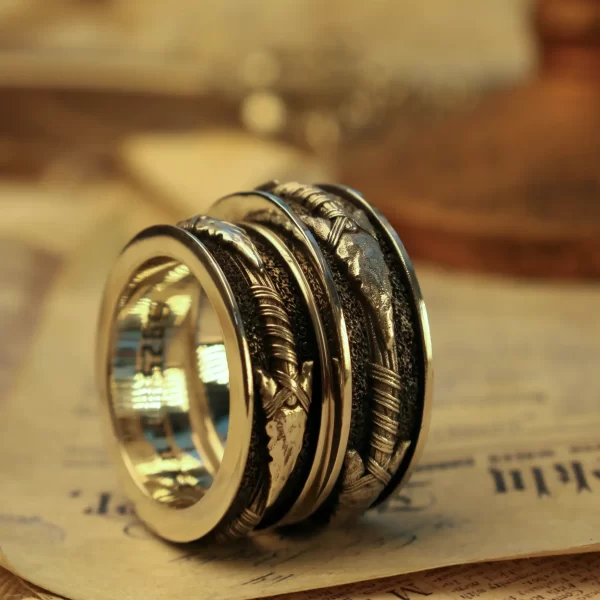 Introducing Silveringdom’s nature-inspired ring, a true masterpiece of artistry and elegance. Crafted from dark silver, this ring features intricate, organic patterns that symbolize strength and growth. The design is a harmonious blend of polished and textured surfaces, highlighting the exceptional craftsmanship and attention to detail that goes into each piece. The dark silver finish adds a touch of sophistication and timeless beauty, making it a standout accessory for any occasion. Perfect for those who appreciate the finer things in life and have a deep connection to the natural world, this ring is more than just an accessory; it’s a statement of your individuality and a celebration of life’s enduring beauty. Embrace the elegance and symbolism of this exquisite ring, and let it be a constant reminder of the strength and growth that define your journey.