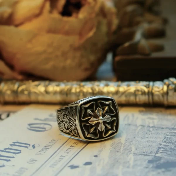 Introducing the exquisite Silveringdom Matching Rings collection, featuring this stunning dark silver ring adorned with a delicate four-leaf clover design. Crafted with precision, the intricate patterns and the prominent clover at the center symbolize luck and prosperity. The dark silver hue adds a touch of elegance and timeless charm, making it a perfect piece for those who appreciate both beauty and meaning in their jewelry. This ring, part of the Silveringdom collection, is ideal for couples seeking matching rings that embody their unique bond. Embrace the blend of nature-inspired motifs and sophisticated craftsmanship with Silveringdom’s latest offering.