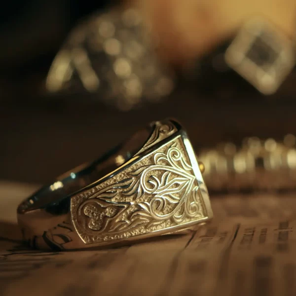 Introducing the exquisite Silveringdom Matching Rings collection, featuring a stunning light silver finish. Each ring is meticulously crafted with intricate engravings and adorned with a delicate four-leaf clover design, symbolizing luck and prosperity. The foreground showcases a beautifully detailed ring, while the matching rings in the background hint at a cohesive and elegant collection. The warm lighting enhances the silver’s natural sheen, highlighting the craftsmanship and artistry involved. Perfect for couples or individuals seeking a touch of elegance and symbolism in their jewelry, these rings are a testament to the timeless beauty and quality of Silveringdom’s creations. Embrace the charm and sophistication of these matching rings, designed to be cherished forever.