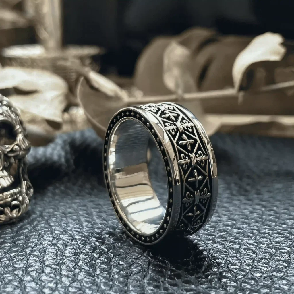 In the enchanting realm of Silveringdom, behold these exquisite matching rings. Crafted from dark silver, they exude an aura of timeless elegance. The intricate design, reminiscent of an iris in full bloom, captures the essence of nature’s beauty. These rings, fit for a knight, symbolize strength and honor. Each band tells a story of enduring love and commitment, making them perfect for couples seeking a unique and meaningful connection. The dark silver’s subtle sheen adds a touch of mystery, enhancing the rings’ allure. Embrace the legacy of Silveringdom with these matching rings, where artistry and tradition unite in perfect harmony.