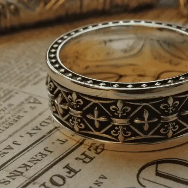 In the heart of Silveringdom, a pair of matching rings crafted from dark silver lie elegantly. These rings, adorned with intricate iris flower patterns, evoke the timeless tales of chivalry and honor. Each ring tells a story of a knight’s valor, with designs reminiscent of ancient crests and symbols of loyalty. The top ring features a prominent ridge, symbolizing strength and protection, while its companion boasts a smoother finish, allowing the iris motifs to blend seamlessly. These rings are not just accessories; they are relics of a bygone era, perfect for those who seek a connection to the noble past of Silveringdom.