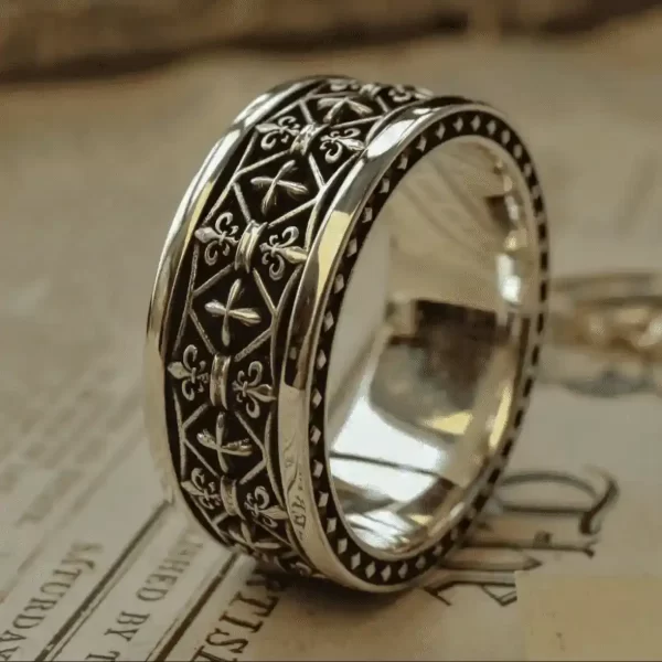 In the heart of Silveringdom, a pair of matching rings gleam with an ethereal glow. Each ring, crafted from dark silver, features intricate designs that resemble the delicate petals of an iris in full bloom. The craftsmanship is reminiscent of a bygone era, evoking the image of a noble knight who might have worn such a ring as a symbol of loyalty and honor. The rings’ interlocking patterns suggest a deep connection, perhaps a vow or a promise, held within their circular embrace. These exquisite pieces are not just jewelry but a tangible link to the storied past and romantic ideals of Silveringdom, where every detail tells a tale of chivalry and timeless beauty.