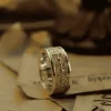 Introducing the exquisite Silveringdom Matching Rings collection, where elegance meets craftsmanship. These rings, crafted from light silver, feature intricate designs inspired by the iris flower and the valor of a knight. Each ring showcases detailed etchings that symbolize strength and beauty, making them perfect for couples seeking a unique bond. The Silveringdom Matching Rings are not just accessories but a testament to timeless love and commitment. Whether you’re celebrating an anniversary or a special occasion, these rings will be a cherished symbol of your journey together. Embrace the elegance and sophistication of Silveringdom with these stunning matching rings.