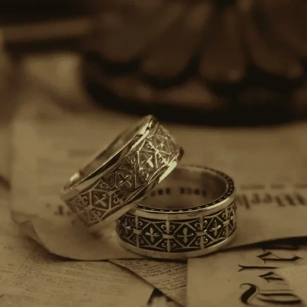 In the enchanting realm of Silveringdom, these matching rings stand as a testament to timeless elegance. Crafted in both light silver and dark silver, they exude a captivating contrast. The intricate designs feature delicate iris motifs, symbolizing wisdom and valor. Each ring is reminiscent of a noble knight’s armor, meticulously detailed to reflect the craftsmanship of a bygone era. The interplay of light and dark silver elements adds depth and sophistication, making these rings perfect for those who appreciate both tradition and modernity. Whether worn as a symbol of unity or as a statement piece, these rings from Silveringdom are sure to leave a lasting impression.