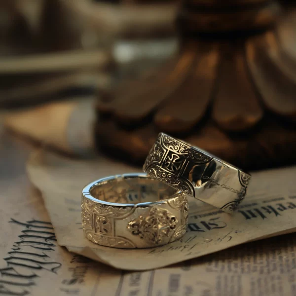 These exquisite matching rings from Silveringdom are a perfect blend of elegance and symbolism. Each ring features a beautifully crafted cross at its center, symbolizing unity and faith. The rings are designed in contrasting shades: one in light silver, which gleams softly under the light, and the other in dark silver, offering a striking visual contrast. The intricate engravings on both rings add a touch of regal sophistication, making them ideal for couples who appreciate timeless beauty and meaningful designs. Whether worn together or separately, these rings from Silveringdom are sure to make a statement.