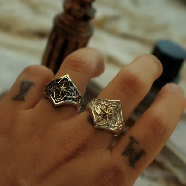 Discover the exquisite craftsmanship of Silveringdom with these matching rings. Each ring embodies a sense of the holy, featuring intricate designs that captivate the eye. The dark silver ring contrasts beautifully with its light silver counterpart, creating a harmonious balance. Inspired by the celestial beauty of Polaris, these rings symbolize guidance and constancy. Perfect for those who appreciate both elegance and meaning in their jewelry, these pieces are more than just accessories—they are talismans of style and significance. Whether worn together or separately, these rings from Silveringdom are sure to make a statement.