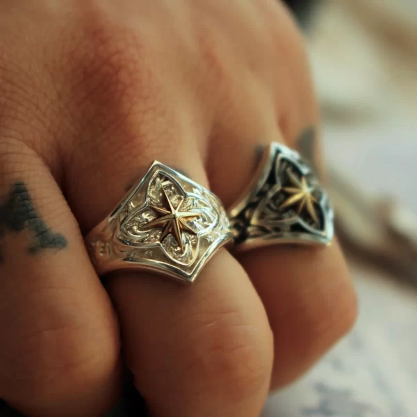 Introducing the Silveringdom Matching Rings, a stunning pair that embodies the essence of elegance and symbolism. These rings feature the Polaris motif, often associated with guidance and direction, giving them a sense of the holy. Crafted with meticulous attention to detail, the rings showcase a beautiful contrast between dark silver and light silver, creating a captivating interplay of shadows and highlights. The intricate design and the harmonious blend of metals make these rings a perfect symbol of unity and commitment. Whether worn as a statement piece or a symbol of a special bond, the Silveringdom Matching Rings are a timeless addition to any jewelry collection.
