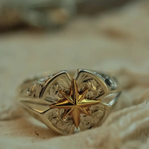 Introducing Silveringdom’s Matching Rings: a stunning pair of rings that embody elegance and romance. Crafted in light silver, these rings feature a delicate rose motif, symbolizing love and beauty. At the heart of each rose lies a golden Polaris, the North Star, representing guidance and constancy. The intricate filigree work enhances the overall design, making these rings a perfect blend of artistry and craftsmanship. Ideal for couples, these matching rings from Silveringdom are not just accessories but a testament to enduring love and commitment. Whether for an engagement, anniversary, or special occasion, these rings are sure to captivate and enchant. Embrace the timeless beauty of Silveringdom’s Matching Rings and let your love shine bright.