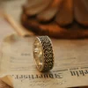In the heart of Silveringdom, a realm where timeless elegance meets modern craftsmanship, lies a collection of vintage vow engagement rings. This image showcases a stunning piece, meticulously handcrafted to perfection. The ring, with its dark silver band, exudes a unique charm that appeals to both traditional and androgynous tastes. Each ring is a testament to the art of customization, allowing couples to create a symbol of their love that is as unique as their bond. The intricate details and the deep, rich hue of the dark silver make these engagement rings stand out, offering a perfect blend of vintage allure and contemporary style. Whether you seek a classic design or a modern twist, Silveringdom’s engagement rings promise to capture the essence of your love story with unparalleled craftsmanship and personalized elegance.